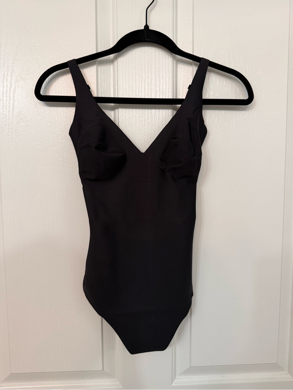 SKIMS Black V‑Neck Sculpting Bodysuit